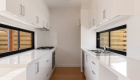 interior photography of West Footscray townhouse new development, architectural design, solid wood floor, white walls, roger thompson photography, kitchen,