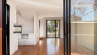 interior photography of West Footscray townhouse new development, architectural design, solid wood floor, white walls, roger thompson photography, living area, kitchen,