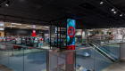 target retail store new internal lighting and store design with LEd lights around escalator area