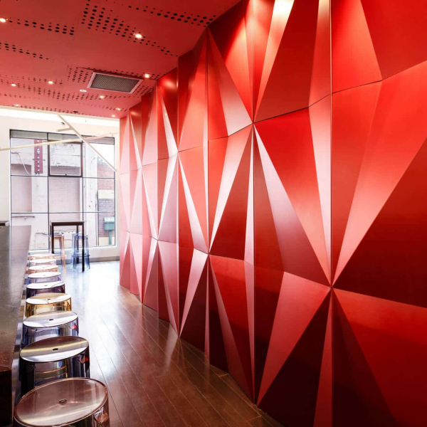Ginger Boy restaurant red custom Feature wall in upstairs public bar area with stoll seating and wood flooring looking across to external window